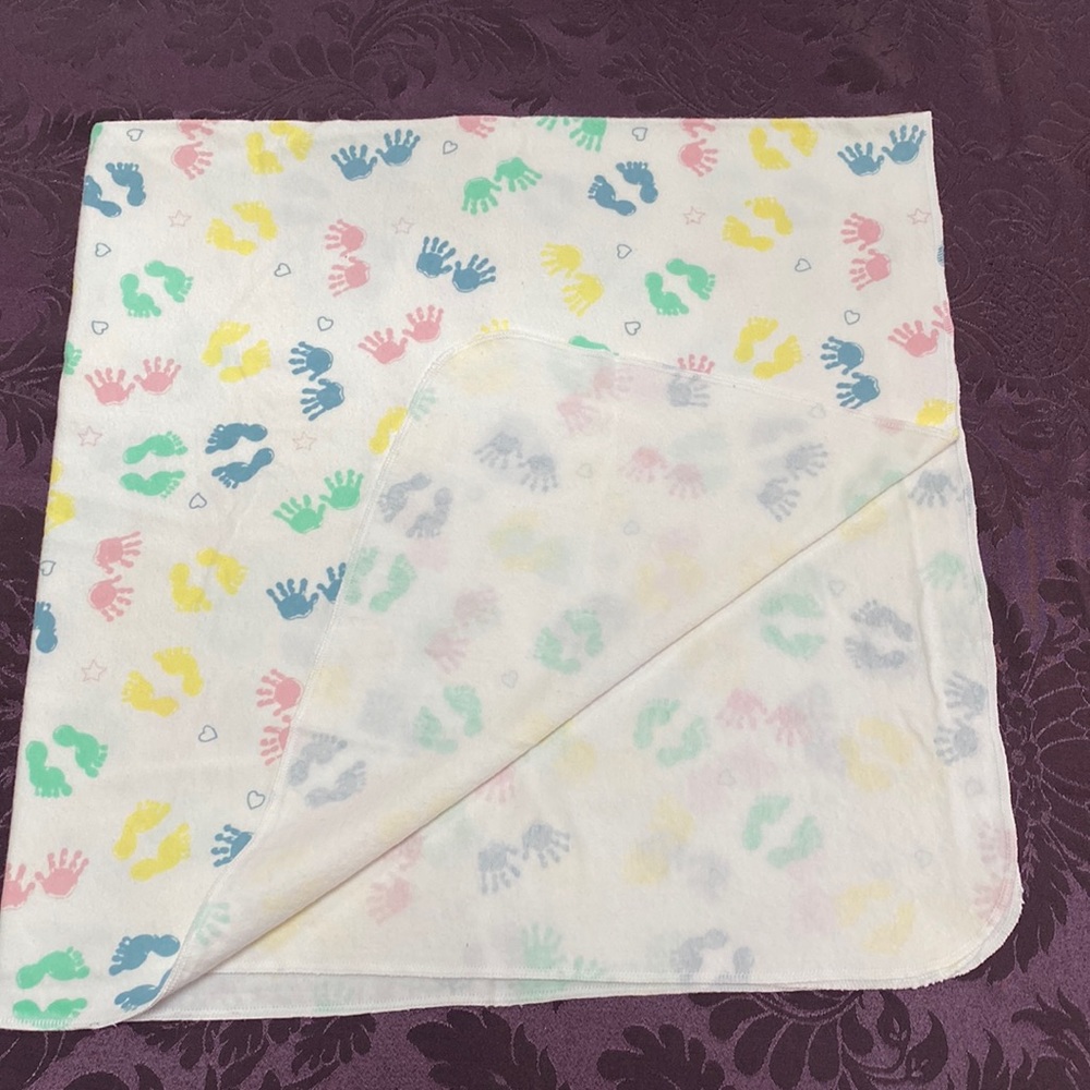 Swaddling receiving blanket and burp cloth.